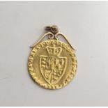 George III gold spade guinea pendant with scroll mount (date worn 178?)