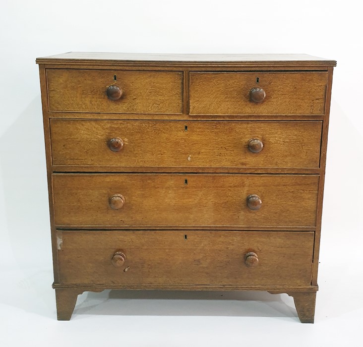 Late 19th century/ early 20th century oak chest, two short over three long drawers to bracket feet ,