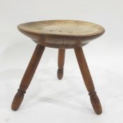 19th century stool with turned seat, on three turned and ringed supports