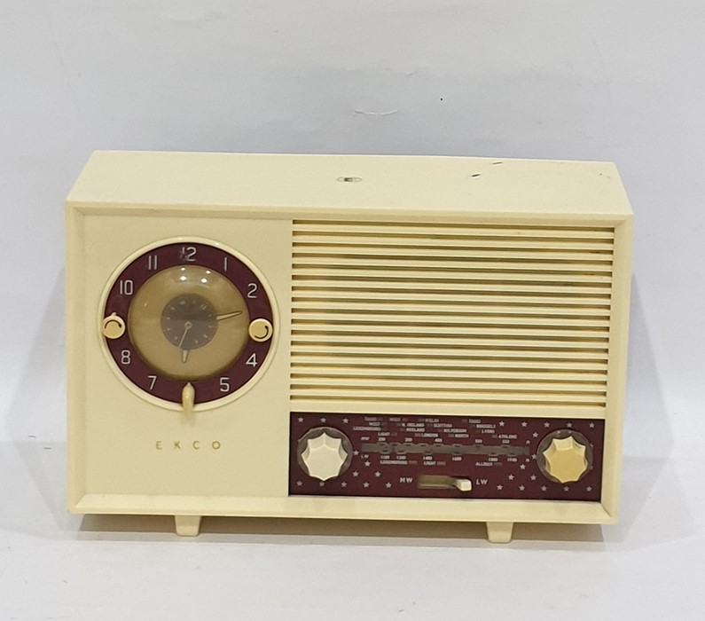 Ekco radio, model number A244, within an ivory-coloured plastic case with claret ground panels, 31cm