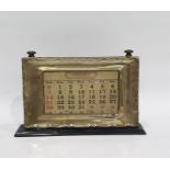 Silver framed desk calendar within an ebonised mount, Birmingham 1927, length 21cm