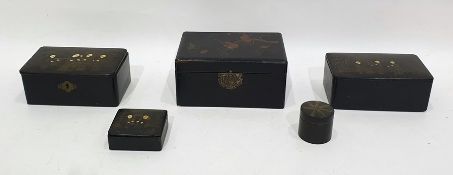 Five black lacquered, painted and gilt boxes and covers in sizes