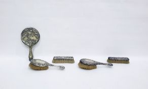 Victorian silver-backed dressing table set comprising of a pair of hairbushes, hand mirror and