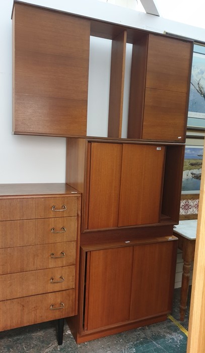 A mid 20th century teak lounge unit, and two sliding door teak cupboards (3)Condition Reporttop unit