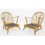 Two Ercol beech framed stick back chairs
