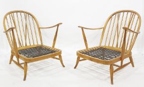 Two Ercol beech framed stick back chairs