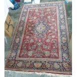 Kashan rug, red ground with stepped central medallion on a foliate decorated field , stepped