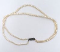 Double string of graduated cultured pearls on silver and marcasite set clasp in Martin & Co,