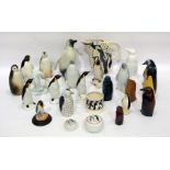 20th century group of porcelain, pottery, glass and wood models of penguins, the tallest 22.2cm