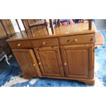 20th century pine sideboard with three drawers above three cupboard doors, to bracket feet
