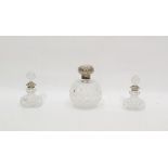 Edwardian silver-capped cut glass scent bottle of globular form, Birmingham 1905 and a pair of