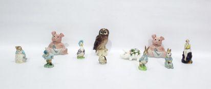 Two Wade pottery NatWest piggy banks, 13.5cm high, various Beatrix Potter figures including a
