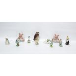 Two Wade pottery NatWest piggy banks, 13.5cm high, various Beatrix Potter figures including a