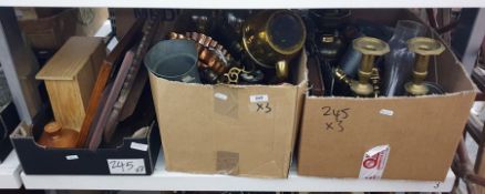 Three boxes of copper and brassware including candlesticks, oil lamps, toasting forks, some prints