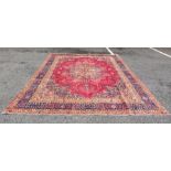 Modern Eastern carpet, pink ground with  central foliate stepped medallions surrounded by a pink