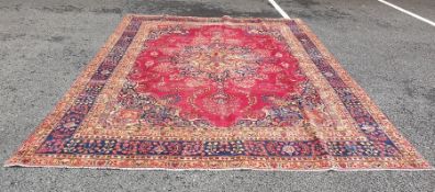 Modern Eastern carpet, pink ground with  central foliate stepped medallions surrounded by a pink