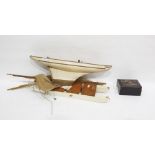 Wooden model of a sailing boat, 53.2cm long,  a group of lacquer boxes in sizes, gilt with scrolling
