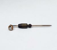 Gold-coloured metal stickpin set with old rose cut diamond in open claw setting, the stone 0.2ct