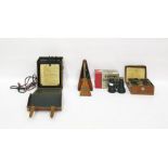 Avometer, model no.40, cased, a Megger circuit testing ohmmeter, cased, a metronome by Maelzel,
