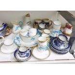 Booths Pottery 'Real Old Willow' pattern part tea service to include four tea cups, a coffee can,