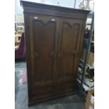 20th century oak two-door wardrobe raised to plinth base