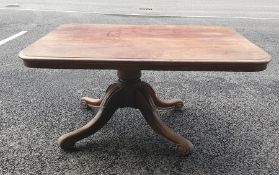 A 19th century mahogany table, the rectangular top with rounded corners on single pedestal to four