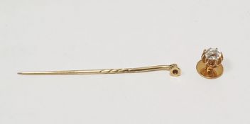 Gold-coloured metal tie stud with stickpin attachment set with old cut cushion-shaped rounded