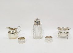 Circular silver sugar bowl with flared rim, reeded waist, raised on pad feet, Birmingham 1919, a