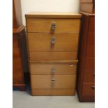 A 20th century pair of teak two drawer bedside chests (by Stag)