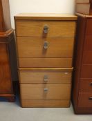 A 20th century pair of teak two drawer bedside chests (by Stag)