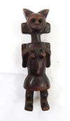 A Tanzanian Kwele tribe statue of female form