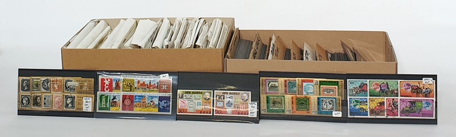 Two boxes of thematics, one box of animal covers and one box of mixed assorted stamps ( 2 boxes)