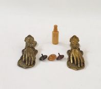 Two Victorian style brass paper clips modelled as hands, a set of dice in turned wood bottle