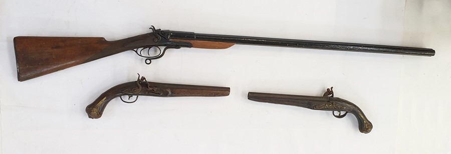 Pair late 18th century Indian pistols together with double -barrelled shotgun - a theatrical prop