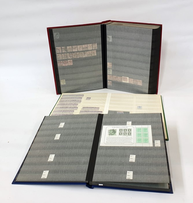 Three stock books of mint Queen Elizabeth II decimal stamps, mint George V and George VI,  and