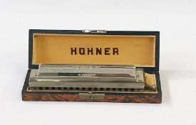 A Hohner chromonica, No. 64, boxed