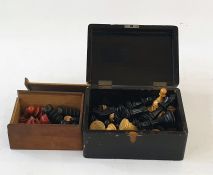 Quantity of vintage wooden chess pieces in black and light wood in lacquered box and another black