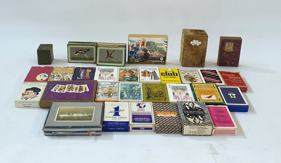 A collection of boxed playing cards, card games, dominoes, a tin case set of patience and an Italy