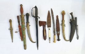 Twelve bladed weapons, to include a Kukri etc. ( 1 box)