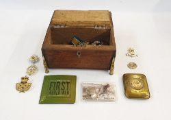 World War I oak trench art box containing military badges and coins