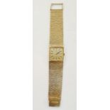 Gent's 9ct gold Longines wristwatch with gold bark-finish face and integral bark-finish cuff