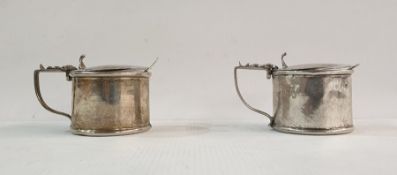 Silver mustard pot of cylindrical form with blue glass liner, Birmingham and a white metal similar