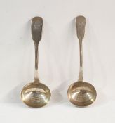 Two similar Georgian silver fiddle pattern sauce ladles, 4.2ozt (2)