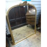 Reproduction guilt over mantel mirror with shelf and foliate pediment, gadrooned border; 110cm x