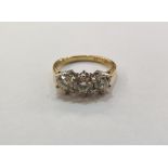 18ct gold three-stone diamond ring, the claw set stones 1.50ct total approx