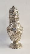 Silver sugar caster with floral repousse decoration, raised on a circular foot, London 1900,