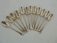 Set of 12 Georgian silver rat-tail pattern teaspoons, crested (marks rubbed), 5.4ozt Condition