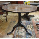 19th century mahogany circular centre table, the circular top with carved decoration, on birdcage