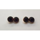 Pair of gold coloured metal and cabochon amethyst cufflinks, each double circle