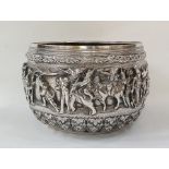 19th century Burmese silver bowl decorated with warriors, elephant, oxen and figures in boat (some